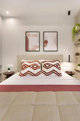 a bedroom with a large white bed with two pillows at Athenian Modern & Luxury Apartments in Athens