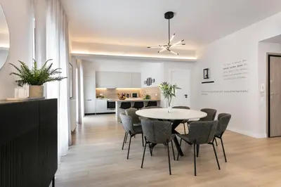 a dining room and kitchen with a table and chairs at Athenian Modern & Luxury Apartments in Athens