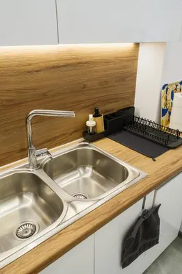 a stainless steel sink in a kitchen next to a counter at 2 br cozy stylish apartment in Athens