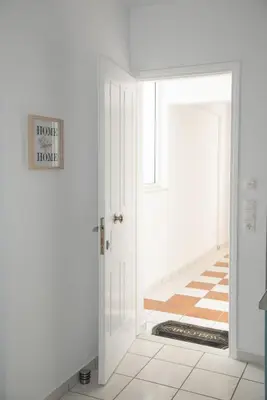 an open door with a sign that reads home mortgage at Anthilia's House in Porto Rafti