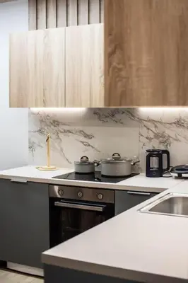 a kitchen with pots and pans on a stove at Quiet Studio With Free Parking in Athens