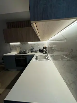 a kitchen with two sinks and a counter top at Quiet Studio With Free Parking in Athens