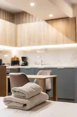a pile of towels sitting on top of a table at Quiet Studio With Free Parking in Athens
