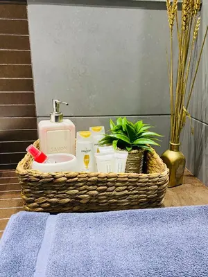 a basket with a sink and toiletries on a table at Marina Zeas Seaview House-MarinaQ in Piraeus