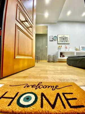 a welcome mat on the floor in front of a door at Marina Zeas Seaview House-MarinaQ in Piraeus
