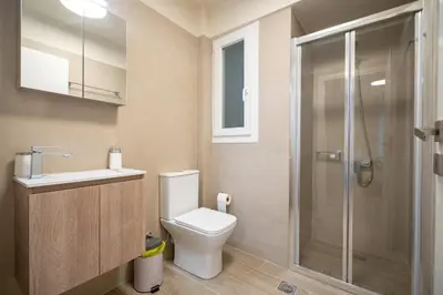 a bathroom with a toilet sink and a shower at Ilisia 2 person apartment by MPS in Athens