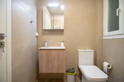 a small bathroom with a toilet and a sink at Ilisia 2 person apartment by MPS in Athens