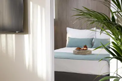 a bedroom with a bed with a basket on it at Hestia - Asklipiou 9 in Athens