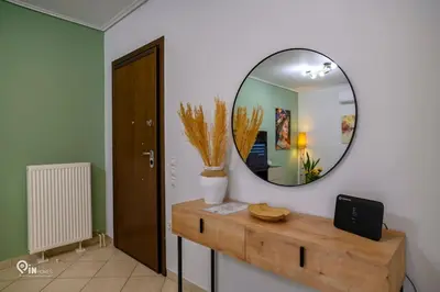 a room with a mirror and a wooden table at Thyme Out - Modern Apartment in Egaleo-Athens in Athens