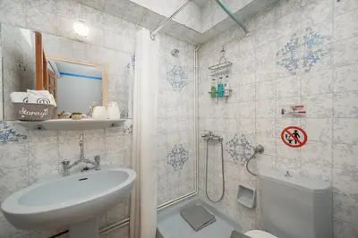 a bathroom with a sink and a toilet and a shower at Φ Villa by A&D Properties in Porto Rafti