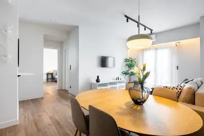 a dining room and living room with a table and chairs at Nostalgia 1-Bedroom Apartment in Athens in Athens