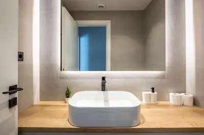 a bathroom with a white sink and a mirror at Nostalgia 1-Bedroom Apartment in Athens in Athens