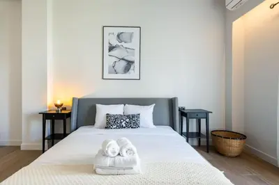 a bedroom with a bed with two towels on it at Nostalgia 1-Bedroom Apartment in Athens in Athens