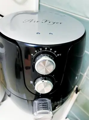 a black and white toaster sitting on a counter at Cozy appartment Panathianiko Stadio in Athens