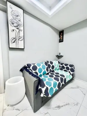 a bedroom with a bed with a cow print blanket at Cozy appartment Panathianiko Stadio in Athens