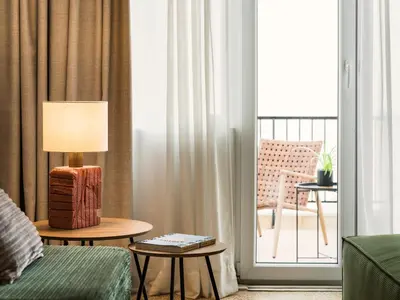 a hotel room with a bed and a balcony at Anasa Hotel Athens in Athens