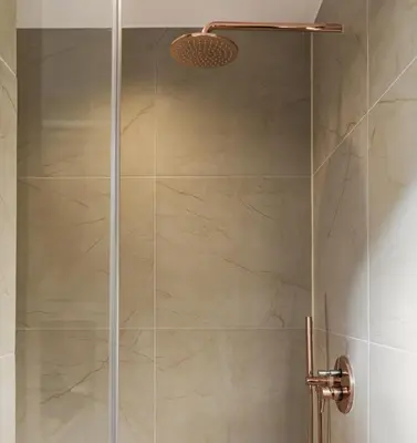a shower stall with a glass shower door at Anasa Hotel Athens in Athens
