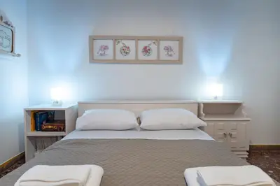 a bedroom with a bed with two white pillows at Keratsini 2 bedroom 4 pers apart by MPS in Piraeus