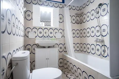 a bathroom with a white toilet and a sink at Keratsini 2 bedroom 4 pers apart by MPS in Piraeus