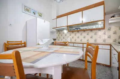 a kitchen with a white table and some chairs at Keratsini 2 bedroom 4 pers apart by MPS in Piraeus