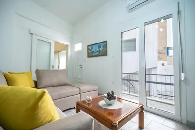 a living room with a couch and a table at Keratsini 2 bedroom 4 pers apart by MPS in Piraeus