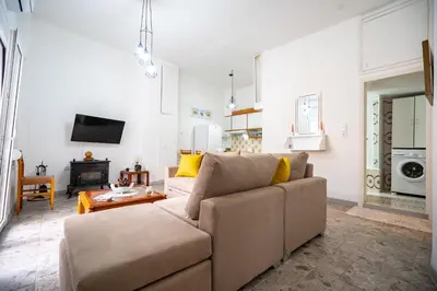 a living room with a couch and a table at Keratsini 2 bedroom 4 pers apart by MPS in Piraeus