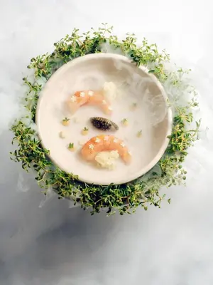 a plate of food with shrimp in a wreath at The Margi in Athens