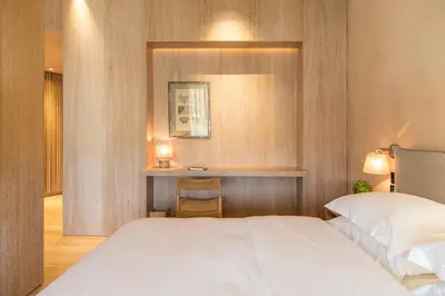 a bedroom with a white bed and a desk at The Margi in Athens