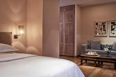 a bedroom with a bed and a couch and a table at The Margi in Athens