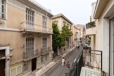 a city street with people walking down the street at Athenian Gate to Plaka by Athenian Homes in Athens