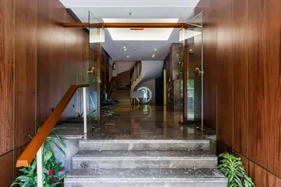 a hallway with stairs in a building at Delice Hotel - Family Apartments in Athens