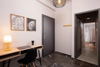 a home office with a desk and a door at Acropolis Amazing View: One-Bedroom Gem in Athens