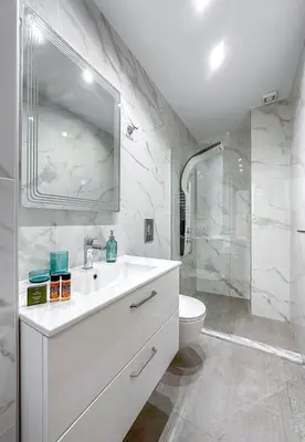 a white bathroom with a sink and a toilet at LIV - Modern Spacious Apartment in Gazi in Athens