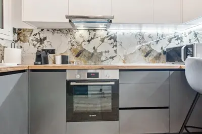 a kitchen with a stove and a counter top at Two-Bedroom Apartment in Pagrati in Athens
