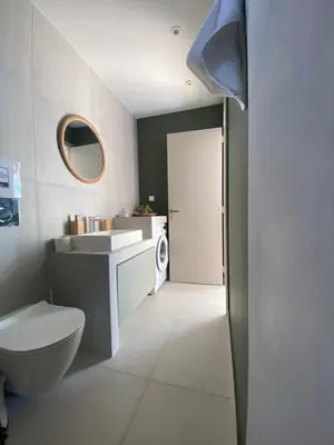 a bathroom with a toilet and a sink and a mirror at Aphrodite Suite byArtistUnknown in Vari