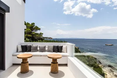 a view of the ocean from the balcony of a house at Greece Dream Holidays Villas 1 in Athens