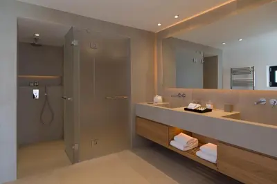 a bathroom with a sink and a shower and a mirror at Greece Dream Holidays Villas 1 in Athens