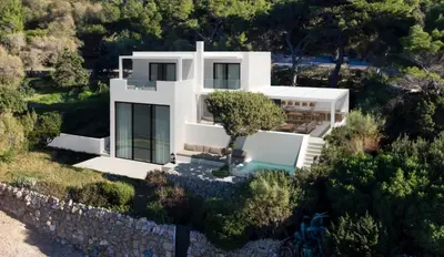 an aerial view of a white house with a stone wall at Greece Dream Holidays Villas 1 in Athens