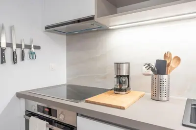 a kitchen with a counter with a coffee maker on it at Bright & Breezy Glyfada Studio in Athens