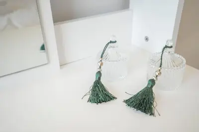 a pair of fringe earrings on a white counter at Tranquil Voula Getaway, A Calm Retreat in Voula in Athens
