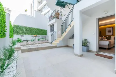 an image of a courtyard in a house at Plaka Apartments - Acropolis View in Athens