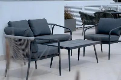a group of chairs and a bench and a table at Plaka Apartments - Acropolis View in Athens