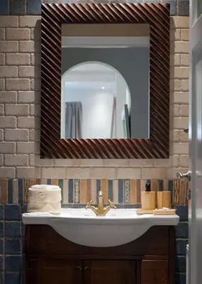 a bathroom with a sink and a mirror at Lussuosa Villa Glyfada in Athens