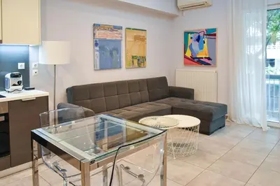 a living room with a couch and a table at Apartment in Kolonaki in Athens