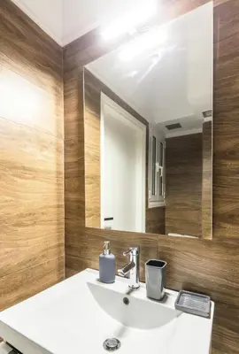 a bathroom with a sink and a mirror at Cosy Central Apartment in Plaka in Athens