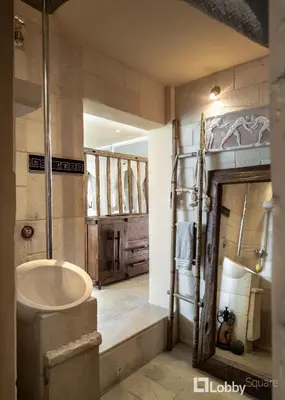 a bathroom with a large sink and a shower at OBSRV Penthouse by LobbySquare in Athens