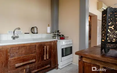 a kitchen with a sink and a stove at OBSRV Penthouse by LobbySquare in Athens