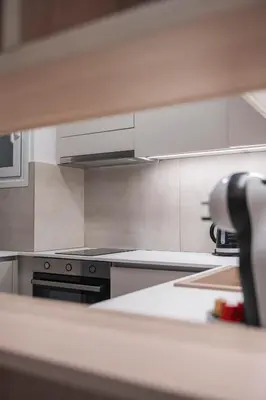 a kitchen with a stove top oven in a kitchen at Oculus Gelonos 1 BD City Apartment by Live&Travel in Athens
