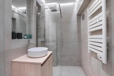 a bathroom with a sink and a shower at Oculus Gelonos 1 BD City Apartment by Live&Travel in Athens