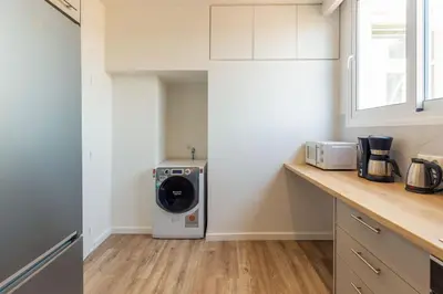 a kitchen with a washer and dryer on a counter at Holodek Apartments : Akropolis in Athens